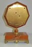CARTIER PARIS ART DÉCO STYLE TABLE CLOCK
Rare and elegant Art Deco style table clock, in blood jasper, mother-of-pearl, enamel and gilded brass, quartz movement.