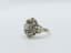 FLOWER DIAMOND RING
18k white gold ring set with one central brilliant-cut diamond weighing apporx. 0,18ct surrounded by rose-cut diamonds