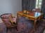 REGENCY-STYLE FLAT DESK IN VENEERED WOOD WITH THREE DRAWERS, CIRCA 1900