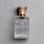 CRYSTAL PERFUME BOTTLE DECORATED WITH FLOWERS AND SILVER STOPPER