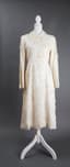 DOLCE & GABBANA
Beige silk trench coat with hand-embroidered flowers