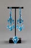 BLUE TOPAZ AND 18K WHITE GOLD GIRANDOLE EARRINGS AND RING
