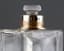 PERFUME FLACON WITH BLUE AND WHITE ENAMEL
 ON SILVER WITH CARTIER LID, 1927