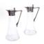 A PAIR OF SILVER AND GLASS CLARET JUGS
WITH SILVER MOUNTS
H: 27,5 cm, D: 12 cm