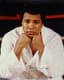 MUHAMMAD ALI (1942-2016), AUTOGRAPH
SIGNED PHOTOGRAPH 
Color glossy photo of Muhammad Ali seated in the ring,