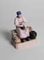 GARDNER’S PORCELAIN SCULPTURE ‘A PEASANT WOMAN CHURNING BUTTER’
Moscow, The Gardner porcelain factory, circa 1870-1890