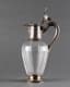 A PAIR OF FRENCH SILVER GILT AND CARVED GLASS DECANTERS ADORNED LIDS WITH PINECONE FINIAL