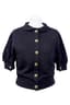 CHANEL
Black cashmere sweater with decorative buttons on the back