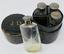A SUITE OF FOUR JANE DERVAL ART DECO SILVER-MOUNTED SCENT BOTTLES WITH SILVER STOPPERS