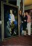 PHOTOGRAPH OF PAINTER ULISSE SARTINI (BORN 1943)
PRESENTING HIS PORTRAIT OF AUDREY HEPBURN IN HIS STUDIO TO OPERA SINGER GABRIELLA TUCCI