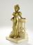 ERNEST WANTE (1872-1960)
Gilded bronze female figure leaning on a marble balcony