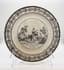 PAIR OF PLATES:
CHOISY FAIENCE PLATE, PLACE DE VENDOME AND TALKING PLATE, EARLY XVIII CENTURY