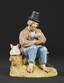 An old peasant drinking water from a bucket: A porcelain figure with a cassette