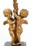A PAIR OF GILT-BRONZE PUTTI CANDLE HOLDERS, 19th century