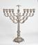 A RUSSIAN STERLING SILVER HANUKKAH LAMP
WITH DETACHABLE OIL JUG
DECORATED WITH FLORAL PATTERN IN THE FORM
OF ROSE BUDS ON THE CANDLESTICKS AND BASE
First half of XX century