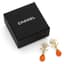 CHANEL 
Drop earrings with orange beads and a gold-tone CC logo, Fall 2023