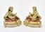 PAIRS OF BRONZE CHENETS
Couple of gilt bronze cherubs seated on molded red marble terraces resting on bases decorated with