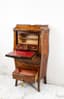 A LOUIS XV STYLE DROP-FRONT SECRETARY DESK WITH FLORAL MARQUETRY DECORATION, CURVED UPRIGHTS, GILDED AND CHASED BRONZES AND FOUR LOWER DRAWERS