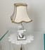 A PAIR OF FIGURAL CHINOISERIE TABLE LAMPS