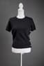 CHANEL 
Black cashmere blend short-sleeved sweater blend faux-pearl button