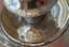 A PAIR OF SILVER TWO-LIGHT CANDELABRA SURMOUNTED BY AN EAGLE