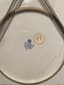 LARGE PORCELAIN DISH «BREAD AND SALT» WITH A FIGURED EDGE DECORATED WITH GILDED WREATHS AND CARTOUCHES WITH FLORAL DECOR
Russia, Moscow, Factory of M. S. Kuznetsov, early 20th century