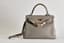 HERMÈS KELLY RETOURNÉ 28
GRAY TOGO LEATHER WITH GILT METAL HARDWARE