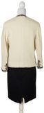 CHANEL
Cream bouclé jacket and black skirt suit