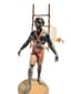 LIQUOR CELLAR 
REPRESENTING A NUBIAN CARRYING ON HIS BACK , AN ENAMELLED GLASS LIQUOR BARREL WITH FOLIAGE DECORATION