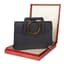 **CARTIER
BLUE LEATHER EVENING CLUTCH BAG WITH TORTOISESHELL HANDLE, CIRCA 1960s