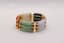 JADE AND GOLD BRACELET
18k gold bracelet with 3 rows of jades in white, green, amber, black and purple colour.