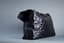CHANEL
Black iridescent leather XXL shoulder travel bag with black metal hardwire