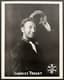 CHARLES TRENET (1913-2001)
Autographed photographic card signed ‘Charles Trenet' with a drawing and inscription in French