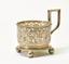 SILVER CUP HOLDER WITH CHISELED FLORAL DECORATION ON THREE SPHERICAL LEGS.
Firm C. Faberge, Supplier of the Imperial court, Russia, Moscow, 1892