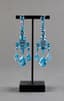 BLUE TOPAZ AND 18K WHITE GOLD GIRANDOLE EARRINGS AND RING
