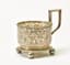 RUSSIAN SILVER CUP HOLDER WITH CHISELED FLORAL DECORATION ON THREE SPHERICAL LEGS
Moscow, 1892