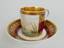 MUG WITH DISH
Porcelain, gilding Russian work XIX century Decorated with paintings, romantic seascape and frieze in the style of Ampir...