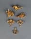 A COLLECTION OF FIVE VINTAGE GOLD BROCHES AND ONE GOLD PENDANT