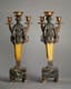 PAIR OF EMPIRE STYLE GILT BRONZE AND PATINATED CARYATID CANDELABRA 
Paris, circa 1870