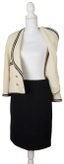 CHANEL
Cream bouclé jacket and black skirt suit