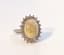 OPAL AND DIAMOND RING
14k white gold ring set with one opal weighing approx. 
5ct surrounded by brilliant-cut diamonds weighing approx. 1ct