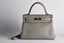 HERMÈS KELLY RETOURNÉ 28
GRAY TOGO LEATHER WITH GILT METAL HARDWARE
