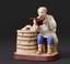 Peasant’s meal: A porcelain figure