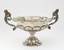 Candy bowl in rocaille style with handles made in the shape of cornucopia.