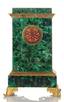 MALACHITE EMPIRE STYLE MANTEL CLOCK
Russia, Imperial Lapidary factory of Peterhof, rst quarter of the XIX century Bronze-gilt, malachite, mosaic