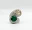 DIAMOND AND EMERALD RING (WITH CERTIFICATE)
18k white gold bypass ring set with one cognac diamond and one emerald, with diamond surround