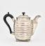 A silver coffee pot