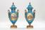 PAIR OF LARGE COVERED VASES
Oval in blue porcelain decorated with medallions adorned with gallant scenes and landscapes, flanked by foliated handles and resting on square base «pied douche».