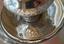 A PAIR OF SILVER TWO-LIGHT CANDELABRA SURMOUNTED BY AN EAGLE