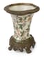 [NO RESERVE]
DECORATIVE CERAMIC AND BRASS VASE WITH POLYCHROME DECORATION OF BIRDS PERCHED AND NESTING AMONG THE FOLIAGE